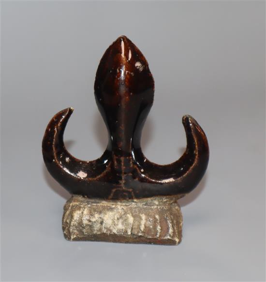 A Chinese Kangxi period brown glazed brush rest